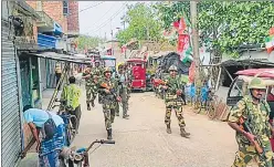  ?? ?? Security personnel conduct a march in Sandeshkha­li on Monday.