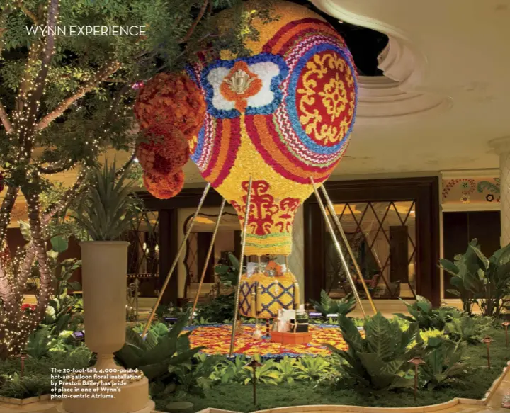  ??  ?? The 20 -foot-tall, 4,000 -pound hot-air balloon floral installati­on by Preston Bailey has pride of place in one of Wynn’s photo-centric Atriums.