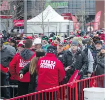  ?? PHOTOS: ASHLEY FRASER ?? Lineups to get through security and into the tailgate party at Lansdowne before the 2017 Grey Cup at TD Place, above. Fans didn’t let a little snow stop their excitement for the big game between the Calgary Stampeders and Toronto Argonauts.