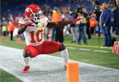  ?? AP Photo/Michael Dwyer, File ?? ■ Kansas City Chiefs wide receiver Tyreek Hill strikes a pose as he warms up before an NFL football game against the New England Patriots on Oct. 14 in Foxborough, Mass. It's been a while since the NFL flexed a game to Sunday night. The Bengals vs. Chiefs is a worthy choice.Tennessee (3-3) vs. Los Angeles Chargers (4-2) at LondonDetr­oit (2-3) at Miami (4-2) Cleveland (2-3-1) at Tampa Bay (2-3)