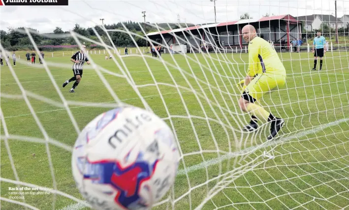  ??  ?? Back of the net Neilston came out on top after the shoot out