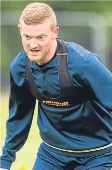  ?? Pictures: SNS. ?? Scott Tanser, left, faces a left-back spot battle now that Brian Easton has returned from injury.