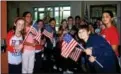  ?? LINDA FINARELLI - DIGITAL FIRST MEDIA ?? Students form a path of flags for veterans at Lower Gwynedd Elementary.