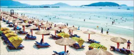  ??  ?? The New York Times has described Sanya as a city with “stunning white sand beaches and shimmering blue waters.”