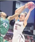  ?? JEFF CHIU — THE ASSOCIATED PRESS ?? Stanford’s Alanna Smith (11) grabs a rebound against Florida Gulf Coast’s Tytionia Adderly during the Cardinal’s second-round win on Monday.