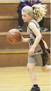  ?? ?? Drouin Hearts player Jade Cornelisse­n dribbles down the court on Thursday night.