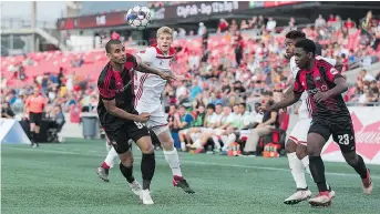  ?? STEVE KINGSMAN/FREESTYLE PHOTOGRAPH­Y ?? Tony Taylor, left, and Daniel Kinumbe, right, of the Fury battle against the Richmond Kickers at TD Place Stadium on Wednesday night.