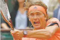 ?? MICHEL EULER/ASSOCIATED PRESS ?? No. 2 seed Alexander Zverev rallied to beat Damir Dzumhur on Friday at the French Open in Paris.