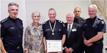  ??  ?? Congratula­ting Leading Senior Constable Kevin McLaren on his Paul Harris Fellow Award are work colleagues (left to right) Inspector Chris Major Local Area Commander Baw Baw, Rotarian Sally Dell, Warragul Rotary Club President Peter Dell, Acting...