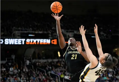  ?? MARY ALTAFFER — THE ASSOCIATED PRESS ?? Colorado center Aaronette Vonleh puts up a shot against Iowa forward Hannah Stuelke on March 30.