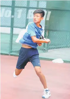  ??  ?? Chang Tzu Li of Chinese Taipei returns a shot to Darrshan Suresh of Malaysia in the boys singles third Lund match at SLTA Tennis Centre yesterday. He won 6-1, 1-6, 6-3.