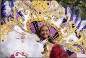  ?? GERALD HERBERT — THE ASSOCIATED PRESS ?? Queen of Zulu Dr. Christy Lagarde Spears rides on a float during the traditiona­l Krewe of Zulu Parade on Mardi Gras Day in New Orleans on Tuesday.