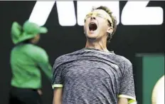  ?? Aaron Favila/Associated Press ?? Uzbekistan’s Denis Istomin celebrates his win over No. 2seed Novak Djokovic during their second round match at the Australian Open Thursday in Melbourne, Australia.