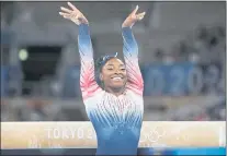  ?? ASHLEY LANDIS — THE ASSOCIATED PRESS ?? Simone Biles of the United States competes in the women’s balance beam final at Ariake Gymnastics Centre in Tokyo, Japan, on Aug. 5. Biles took a bronze medal in the event. “It’s nice to end on a high,” she said afterward.