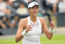  ?? /AFP (See Back Page) ?? Spain’s ace: Garbine Muguruza on Saturday after beating US player Venus Williams 7-5 6-0 during their women’s singles final match of the 2017 Wimbledon Championsh­ips at the All England Lawn Tennis and Croquet Club.