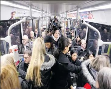  ?? Colleen De Neve/calgary Herald ?? Passengers packed the new west LRT line from the 69th Street Station to downtown after it opened early Monday.