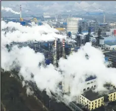  ?? ASSOCIATED PRESS ?? In this Nov. 28, 2019 file photo, smoke and steam rise from a coal processing plant in Hejin in central China’s Shanxi Province.
