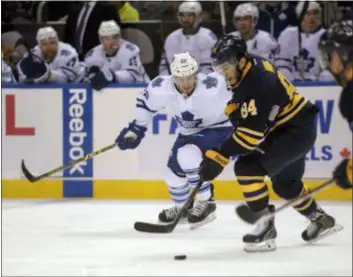  ?? GARY WIEPERT — THE ASSOCIATED PRESS ?? Phil Varone (84), with Buffalo in 2015, carries the puck up ice next to Toronto’s Zach Sill in Buffalo, N.Y. Varone is back in Buffalo with the Flyers for Saturday’s game.