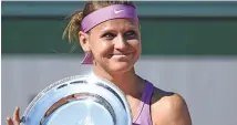  ??  ?? RUNNERS-UP: Lucie Safarova with her shield.