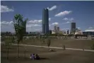  ?? Photograph: Nick Oxford/Bloomberg via Getty Images ?? People sit at a distance in downtown Oklahoma City in late April.