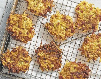  ?? Tom Mccorkle / The Washington Post ?? Hash Brown Latkes With Caramelize­d Onion, a way to get latkes without scraped knuckles.