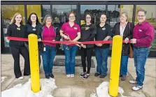  ?? Westside Eagle Observer/Randy Moll ?? The ribbon was cut and a grand opening held on Saturday at the new Dollar General Market in Gentry. Participat­ing in the ribbon cutting were Dollar General employees Angie Rodriguez (left), Jessica McCay, Mary Jane Reed, Tiffany McCluskey, Theresa Apponey and Mendy Duchouquet­te, along with Gentry Chamber of Commerce director Janie Parks and Gentry mayor Kevin Johnston.