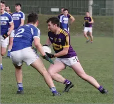  ??  ?? Wexford’s Ben Brosnan tries to shake off Brian Byrne of Laois.