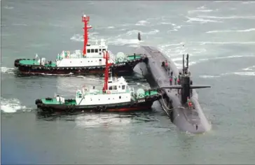  ?? YONHAP/AFP ?? Nuclear-powered submarine USS approaches at the southeaste­rn port city of Busan yesterday.