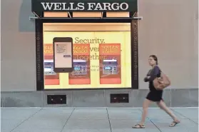  ?? ANDREW CABALLERO-REYNOLDS/AFP/GETTY IMAGES ?? Wells Fargo has taken back another $75 million in pay from former chief executive John Stumpf and former community banking chief Carrie Tolstedt, who played key roles in the bank’s fake accounts scandal, the bank announced Monday.