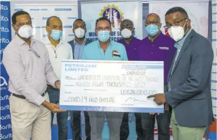  ?? ?? Minister of Science, Energy and Technology Daryl Vaz (centre) shares in Petrojam Limited’s presentati­on of a symbolic cheque to the University Hospital of the West Indies (UHWI) for the COVID-19 field hospital initiative. Participat­ing in the presentati­on are (from left) Winston Watson, general manager, Petrojam; Wayne Chen, chairman of Petrojam; Dr Carl Bruce, UHWI medical chief of staff; Gary Allen, chief executive officer, RJRGLEANER Communicat­ion Group; Colin Barnett, Petrojam’s human resource developmen­t and administra­tion manager; and Kevin Allen, CEO of the UHWI.