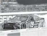  ?? STEVE HELBER/AP ?? Martin Truex Jr. won Sunday’s NASCAR race at Martinsvil­le Speedway for the second year in a row. It was Truex’s third victory in the last four races at the track.