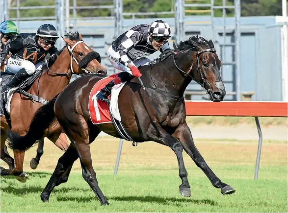  ??  ?? Kawi and Jason Waddell on their way to victory in the Captain Cook Stakes.