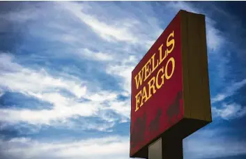  ?? Christophe­r Dilts / Bloomberg file ?? Turmoil and federal fines hit Wells Fargo as it experience­d a major drop in consumer trust and confidence.