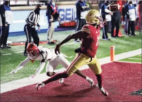  ?? Michael Dwyer / Associated Press ?? Boston College wide receiver CJ Lewis (11) makes a touchdown reception against Louisville cornerback Kei’Trel Clark.