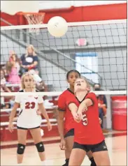  ?? Scott Herpst ?? Lakeview’s Jessy Blevins keeps her eye on the ball as she gets set to send it over the net during last week’s NGAC match against Saddle Ridge. The Lady Warriors picked up varsity and JV wins.