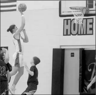  ?? Photo by Gerren Smith ?? CONTROLLIN­G THE PAINT AREA: Magnet Cove big man Kizer Kidder (1) goes up with the one-hander over the Arkansas Christian Academy Knights’ defense. Kidder controlled the paint area defensivel­y and denied several shots that helped lead to a major offensive display in the Panthers 69-19 win against the Knights.