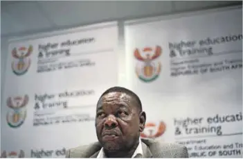  ?? Photos: Gallo Images/City Press/Khaya Ngwenya & Madelene Cronjé ?? Throw the book: Students are charged R6.73 per colour A4 page by a firm owned by a relative of Blade Nzimande (right).