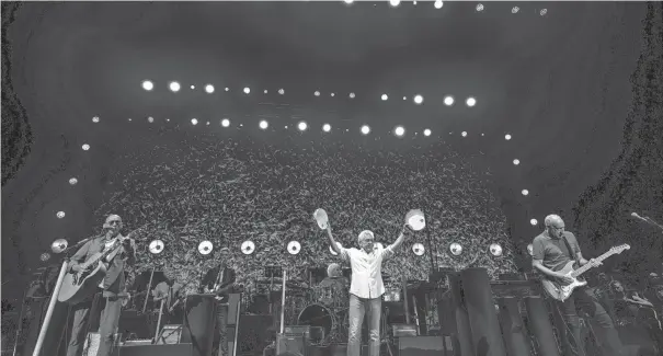  ?? PHOTOS BY JOSEPH SCHELLER/COLUMBUS DISPATCH ?? The Who performed to a near-capacity crowd at Value City Arena Sunday night.