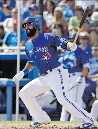  ?? THE ASSOCIATED PRESS FILES ?? Jose Bautista is back with the Blue Jays after playing for the Dominican Republic in the World Baseball Classic. But a sore back is putting off his return to action until at least Friday.
