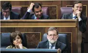  ?? FRANCISCO SECO / THE ASSOCIATED PRESS ?? Spain’s Prime Minister Mariano Rajoy, lower row right, and Deputy Prime Minister Soraya Saenz de Santamaria at the national budget debate on Wednesday.