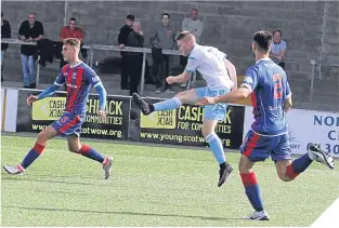  ??  ?? Josh Peters lets fly for Forfar Athletic’s second goal against Elgin.