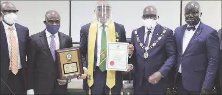  ?? ETOP UKUTT ?? L-R: Former Managing Director, Sterling Bank Plc, Mr. Yemi Adeola; First Vice President, Chartered Institute of Bankers of Nigeria (CIBN), Dr. Ken Opara; Pioneer Managing Director, GTBank Plc, Mr. Fola Adeola; President, CIBN, Mr. Bayo Olugbemi; and Registrar, CIBN, Mr. Seye Awojobi, during the conferment of honorary fellowship on Fola Adeola at the Bankers House, Lagos ...yesterday