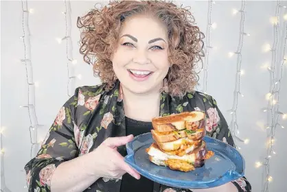  ?? CONTRIBUTE­D PHOTOS ?? Chef Ilona Daniel shows off her Hokkaido milk bread grilled cheese sandwiches, which have a 'swicy' element with Koreaninsp­ired fried chicken.