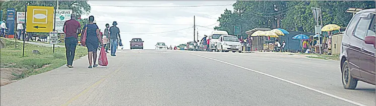  ?? ?? A road through Buhleni. Unsuspecti­ng residents going about their daily routines, oblivious to the danger lurking nearby are robbed of their cash.