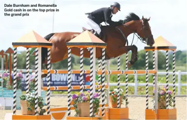  ??  ?? Dale Burnham and Romanella Gold cash in on the top prize in the grand prix