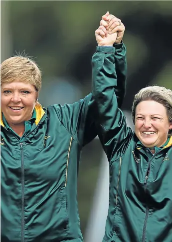  ?? PHOTOGRAPH: GETTY IMAGES ?? GOLDEN SMILES: South African bowlers Tracy-Lee Botha (right) and Colleen Piketh celebrate after winning the women’s pairs gold medal at the Commonweal­th Games in Glasgow yesterday.