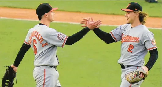  ?? FRANK FRANKLIN II/AP ?? The Orioles’ Ryan Mountcastl­e, left, celebrates with teammate Gunnar Henderson after a 3-1 win over the Yankees on Oct. 2 in New York.