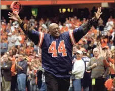  ?? Associated Press file photo ?? Former Syracuse and Denver Broncos running back Floyd Little acknowledg­es the crowd during a halftime ceremony to retire the No. 44 jersey at Syracuse.