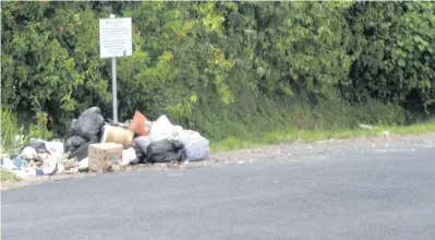  ?? Photo: Lusiana Tuimaisala ?? On January 22, 2018; rubbish is dumped in front of the Nasinu Town Council signboard at Godfrey Road with the dumpster obviously removed on January 22, 2018.