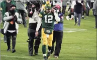  ?? Morry Gash / Associated Press ?? Green Bay Packers quarterbac­k Aaron Rodgers walks off the field after the NFC championsh­ip game against the Tampa Bay Buccaneers in Green Bay, Wis., in January.